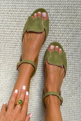 Pink open-toe sandals with ankle strap and heart motif