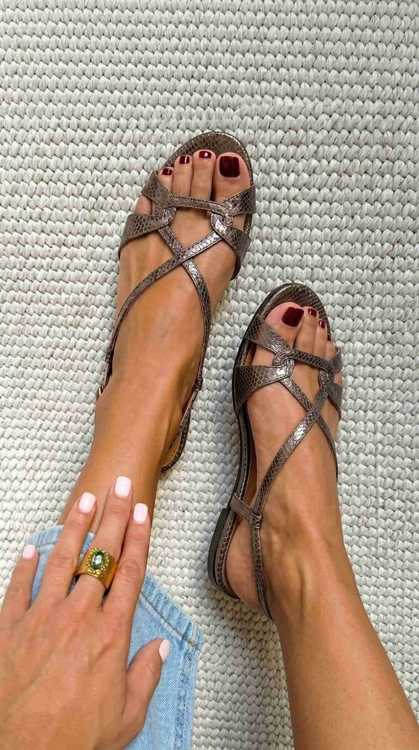 Low-heeled bronze open-toe slingback sandals with a snakeskin-effect finish