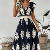 Candela - Vestido maxi barroco con escote en V