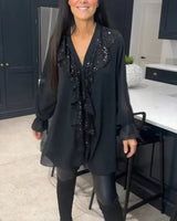 Xenia - Blusa elegante con detalle de volantes
