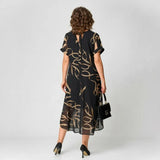 Francisca - Vestido con volante y estampado dorado
