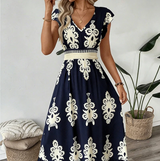 Candela - Vestido maxi barroco con escote en V